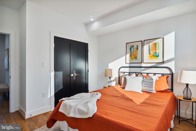 bedroom with a closet and light wood-type flooring