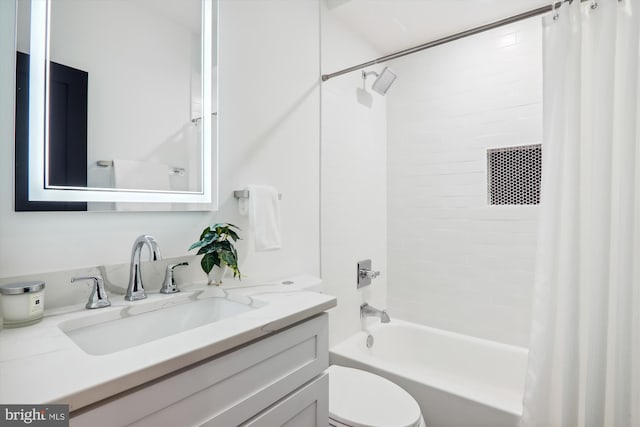 full bathroom featuring shower / tub combo, vanity, and toilet