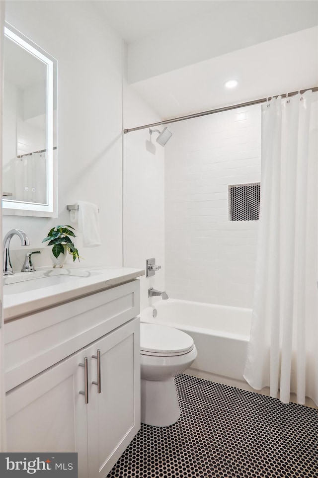 full bathroom with vanity, toilet, and shower / bath combo with shower curtain