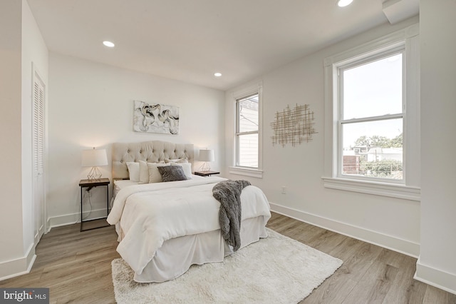 bedroom with light hardwood / wood-style flooring