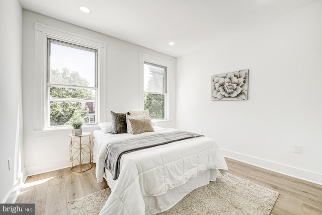 bedroom with light hardwood / wood-style flooring