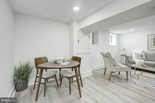 dining space with light hardwood / wood-style floors