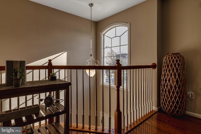 stairs featuring hardwood / wood-style floors