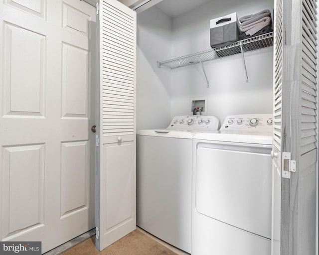 washroom with washing machine and dryer