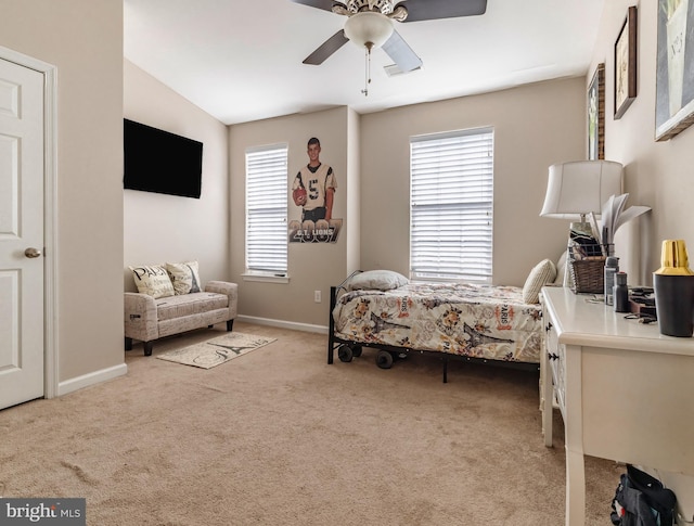 carpeted bedroom with ceiling fan