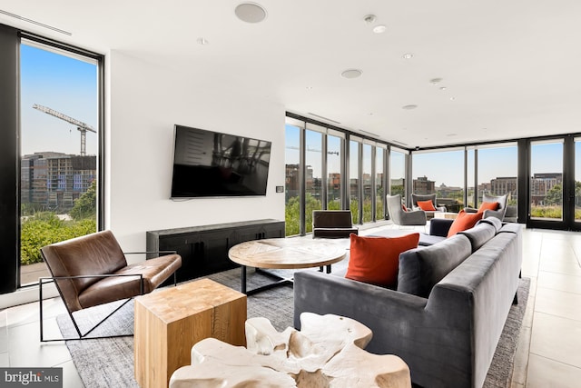 living room with expansive windows, a healthy amount of sunlight, and light tile patterned flooring