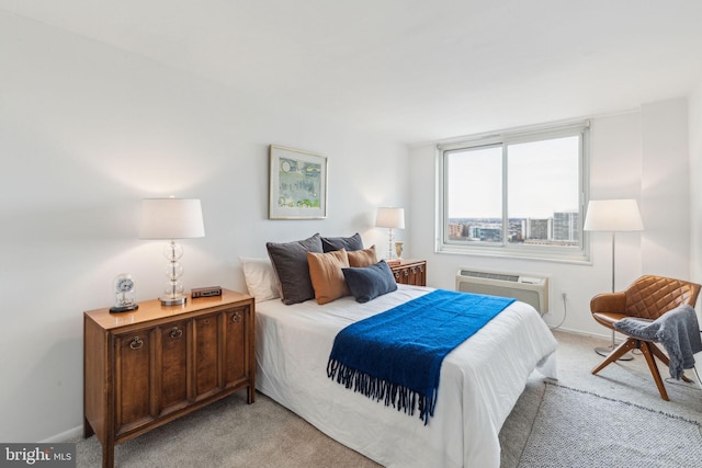 bedroom with light carpet and a wall unit AC