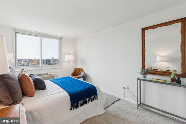 bedroom with a wall mounted air conditioner and carpet flooring