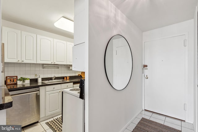 kitchen with tasteful backsplash, white cabinetry, dishwasher, and light tile patterned floors