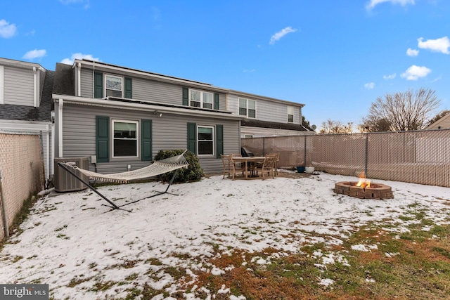 snow covered property featuring a fire pit