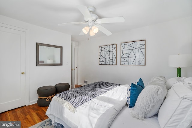 bedroom featuring hardwood / wood-style floors and ceiling fan