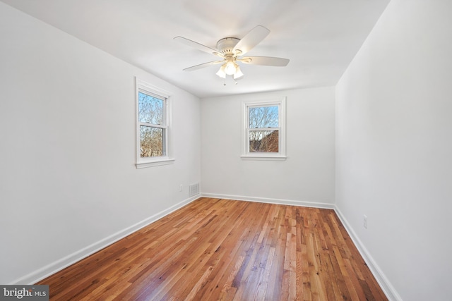 empty room with light hardwood / wood-style flooring and ceiling fan