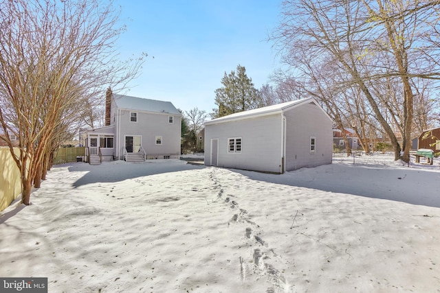 view of snow covered house