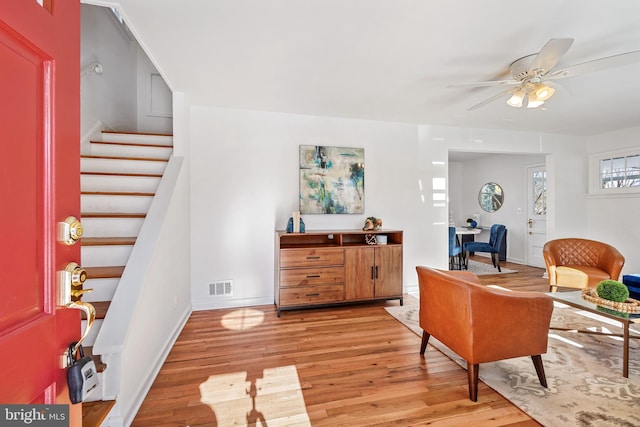 living area featuring ceiling fan and light wood-type flooring