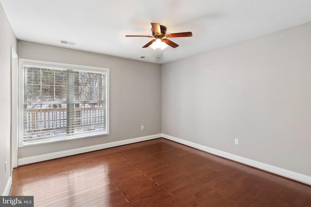 empty room with wood-type flooring and ceiling fan