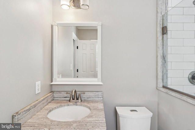 bathroom with vanity and toilet