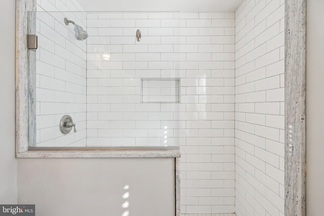 bathroom with a tile shower