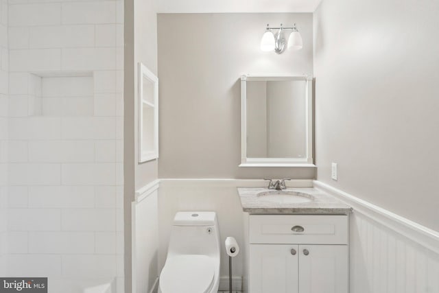 bathroom featuring vanity and toilet