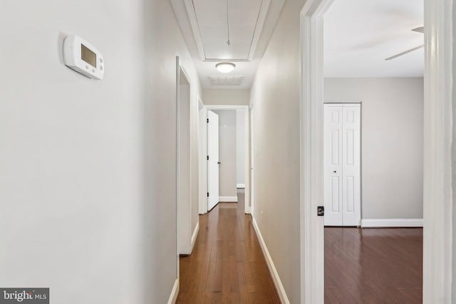 corridor featuring dark hardwood / wood-style floors