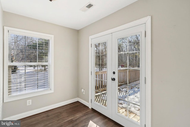 doorway featuring french doors and dark hardwood / wood-style flooring