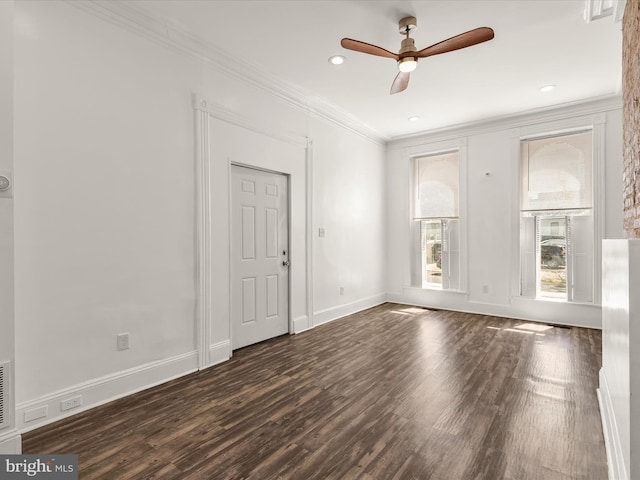 unfurnished room with ceiling fan, dark hardwood / wood-style flooring, and ornamental molding