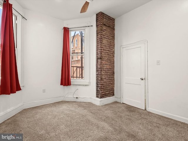 carpeted empty room with ceiling fan