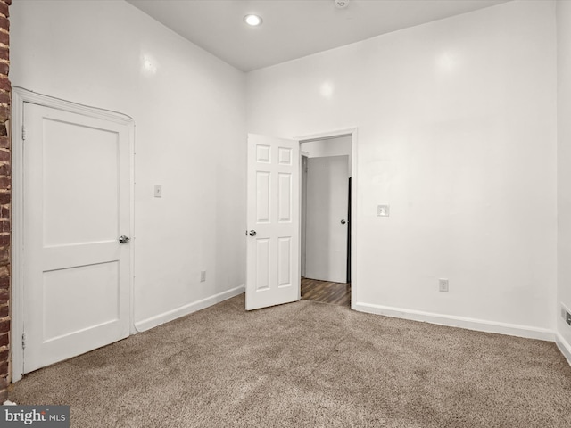 empty room with carpet flooring