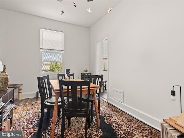 dining space featuring hardwood / wood-style flooring