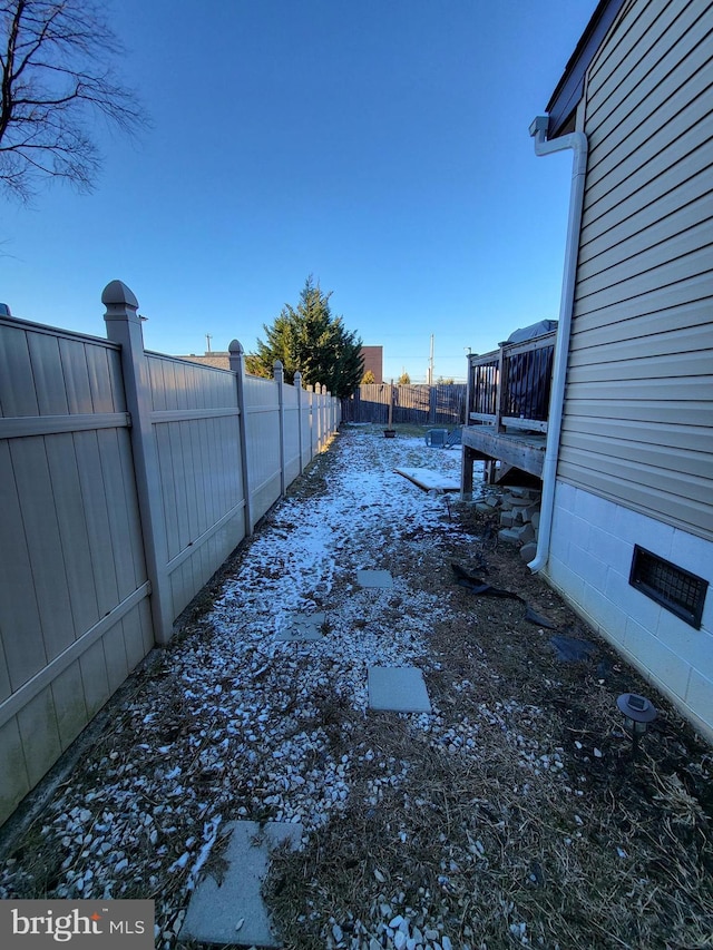 view of yard layered in snow