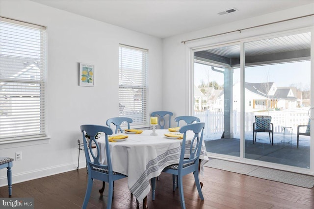 dining room featuring dark wood-type flooring