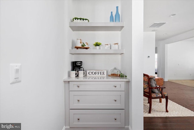 bar featuring gray cabinetry