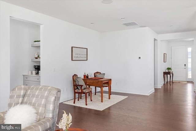 living area with dark wood-type flooring