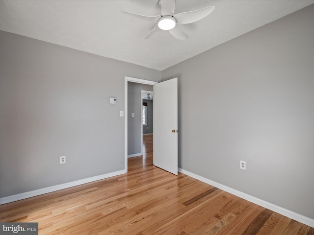 unfurnished room with ceiling fan and light hardwood / wood-style flooring