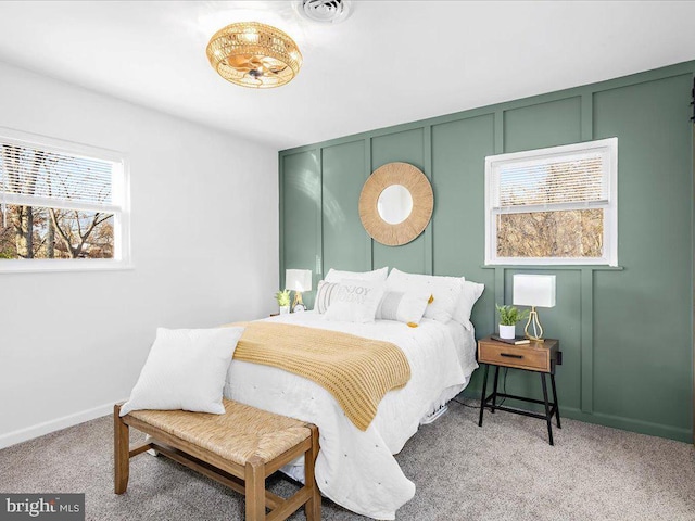 bedroom featuring light colored carpet