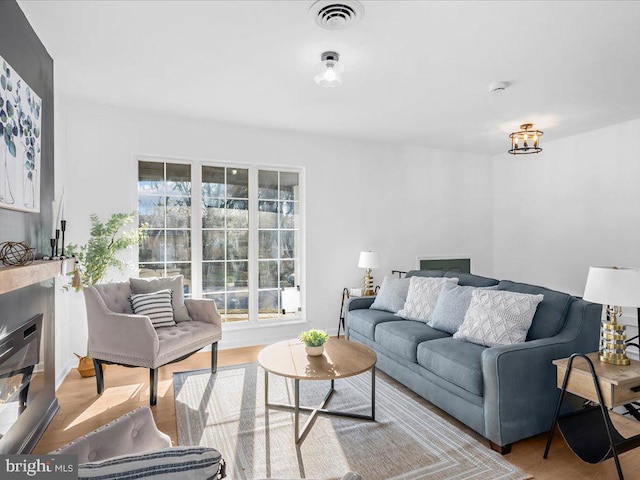 living room with light hardwood / wood-style flooring