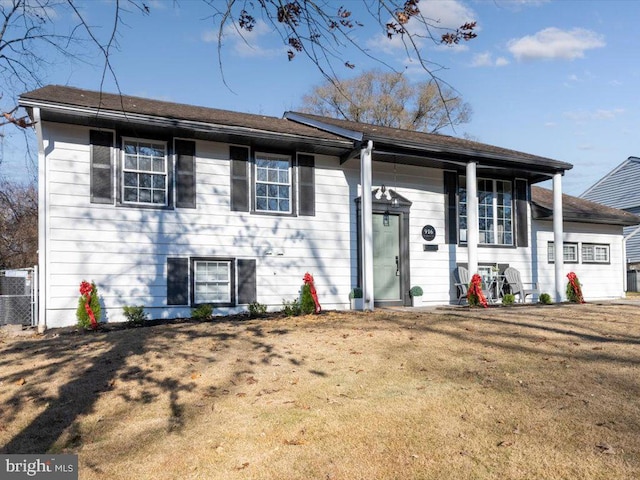 bi-level home with a front yard