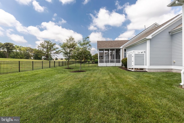 view of yard with a sunroom