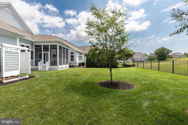 view of yard with a sunroom