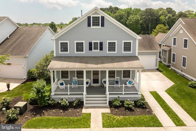 view of front of home with a front yard, a porch, and a garage