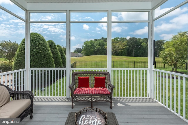 sunroom / solarium featuring a healthy amount of sunlight