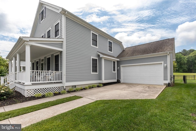 view of front facade featuring covered porch, a garage, and a front yard