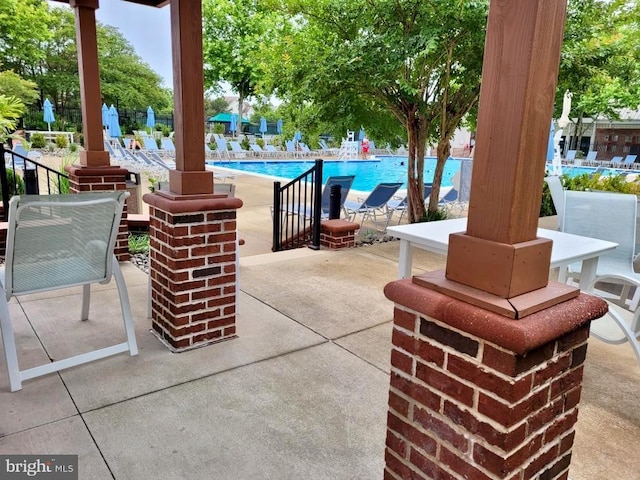 view of patio with a community pool