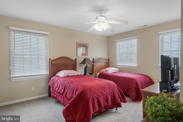 bedroom with ceiling fan and carpet