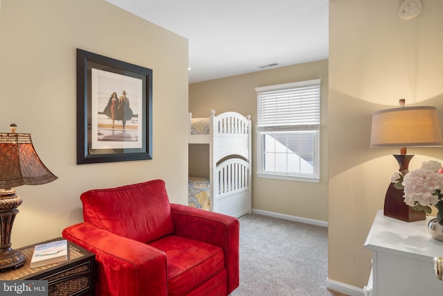 living area featuring carpet floors