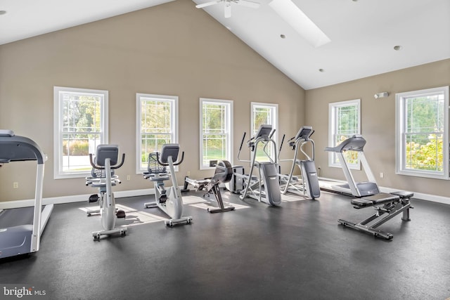 exercise room featuring ceiling fan and high vaulted ceiling