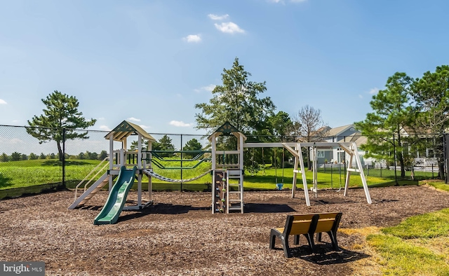 view of playground with a lawn