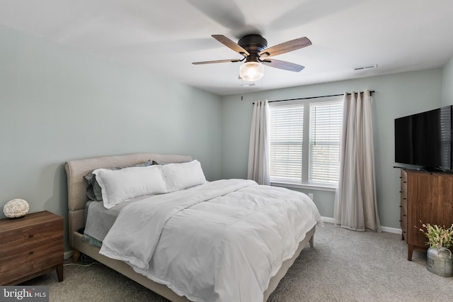 bedroom featuring ceiling fan and light carpet