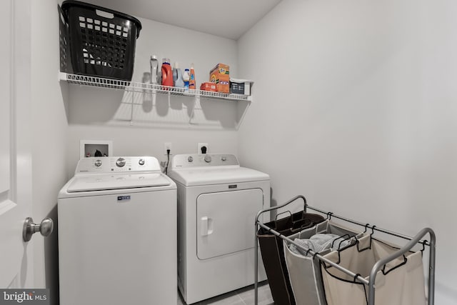 laundry room featuring washer and clothes dryer