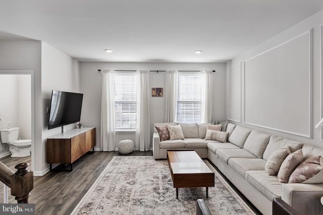 living room with dark hardwood / wood-style floors