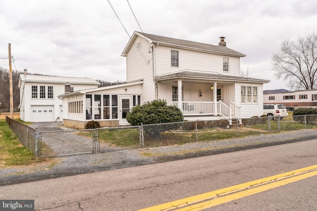 view of front of home featuring a sunroom and a porch